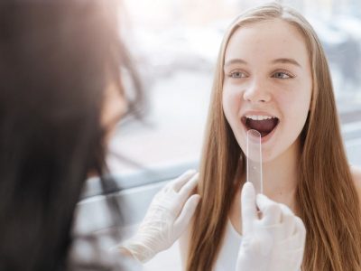 girl with tongue depressor